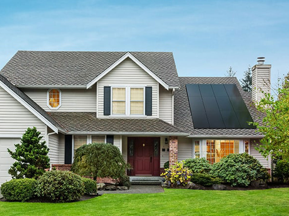 Suburban home with solar panel installation by Wolf River Electric