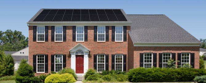 Brick house with solar panels installed on the roof in Burnsville MN