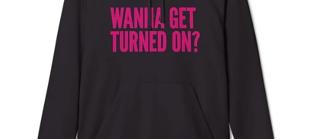 Stylish black hoodie with bold pink 'Wanna Get Turned On?' slogan by Wolf River Electric, promoting clean energy in comfort and style.