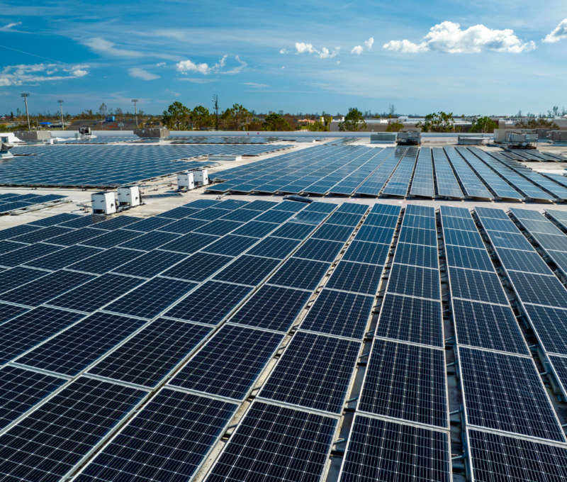 Large-scale commercial rooftop solar installation with multiple solar panel arrays Large-scale commercial rooftop solar installation with multiple solar panel arrays
