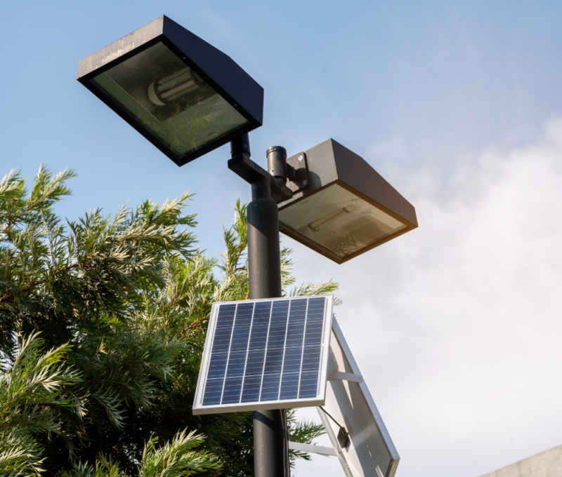 Dual outdoor solar-powered flood lights with mounted solar panel for commercial lighting Dual outdoor solar-powered flood lights with mounted solar panel for commercial lighting