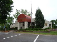 Front of the Hilltop City Hall building during the day.