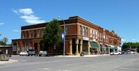 A building on Main Street in Mapleton, MN during the day.