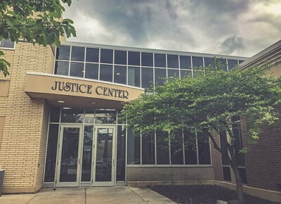 Carver County Justice Center entrance in Minnesota with glass facade and modern architecture on cloudy day