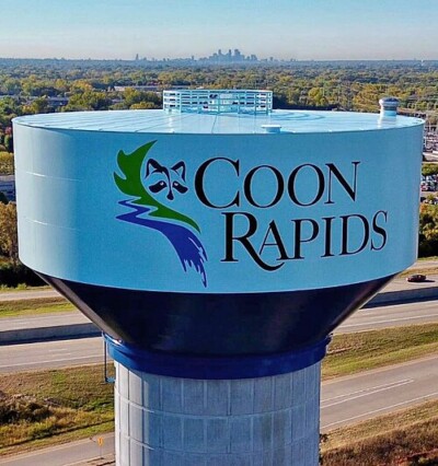 The Coon Rapids Water Tower looking toward downtown Minneapolis, MN during the day.