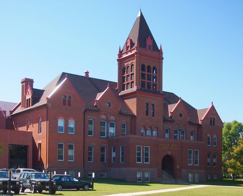 Front shot of the Douglas County Courthouse during the day with a clear blue sky behind it. Front shot of the Douglas County Courthouse during the day with a clear blue sky behind it.