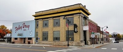 Front shot of the Foley Drug building during the day.