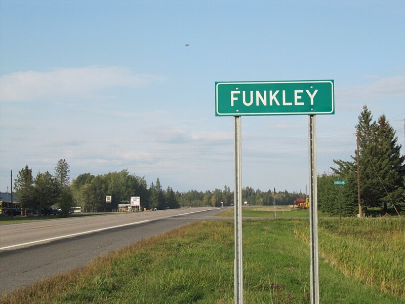 A Funkley road sign along a highway.