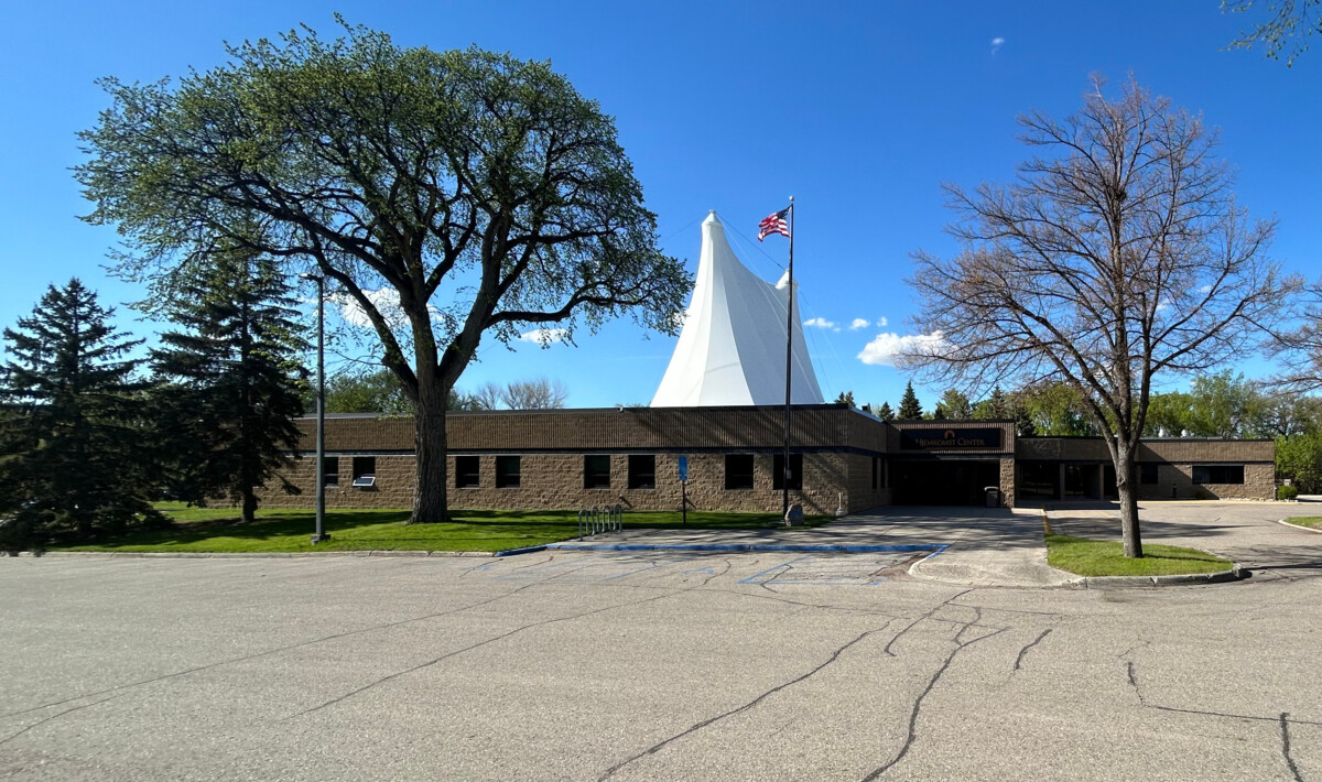Front of the Hjemkomst Center in Moorhead, Minnesota during the day.