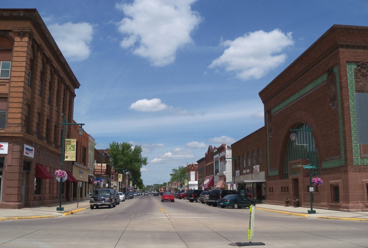 Street with buildings and cars driving in Owatonna, Minnesota. Street with buildings and cars driving in Owatonna, Minnesota.