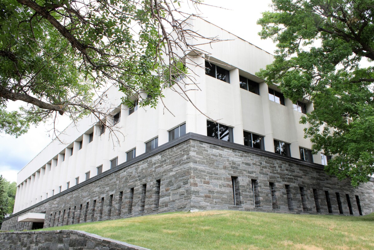A corner shot of the Polk County Government Center with trees and grass surrounding it during the day. A corner shot of the Polk County Government Center with trees and grass surrounding it during the day.