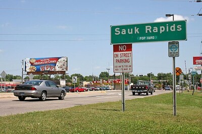 Roadside sign for Sauk Rapids during the day. Roadside sign for Sauk Rapids during the day.