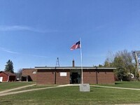 School and government offices in Scanlon, Minnesota during the day.