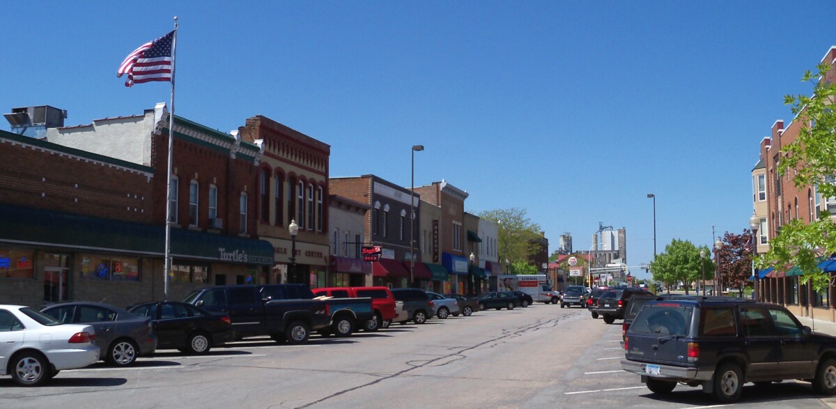 Businesses and cars parked on a street in Shakopee, Minnesota during the day. Businesses and cars parked on a street in Shakopee, Minnesota during the day.