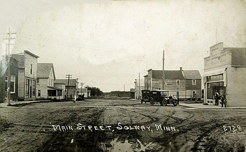 Vintage Main Street in Solway, Minnesota early 1900s with historic storefronts and horse-drawn carriage on dirt road Vintage Main Street in Solway, Minnesota early 1900s with historic storefronts and horse-drawn carriage on dirt road