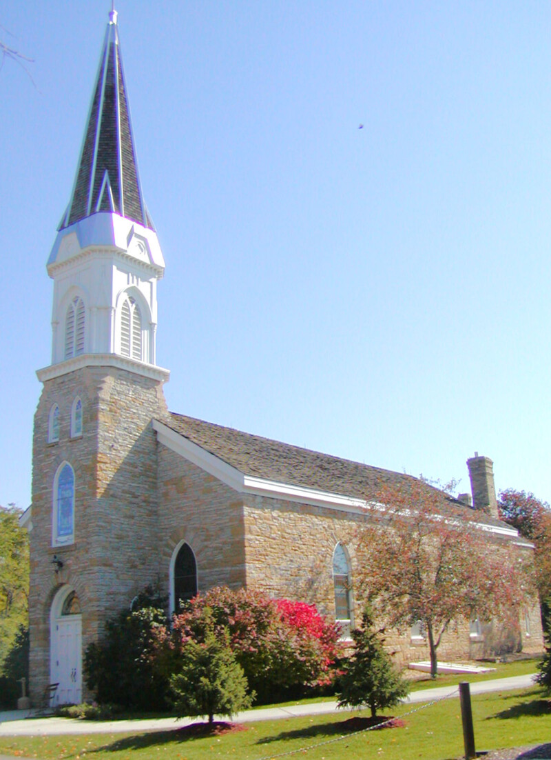 Corner shot of St. Peter's Church in Mendota, Minnesota during the day.