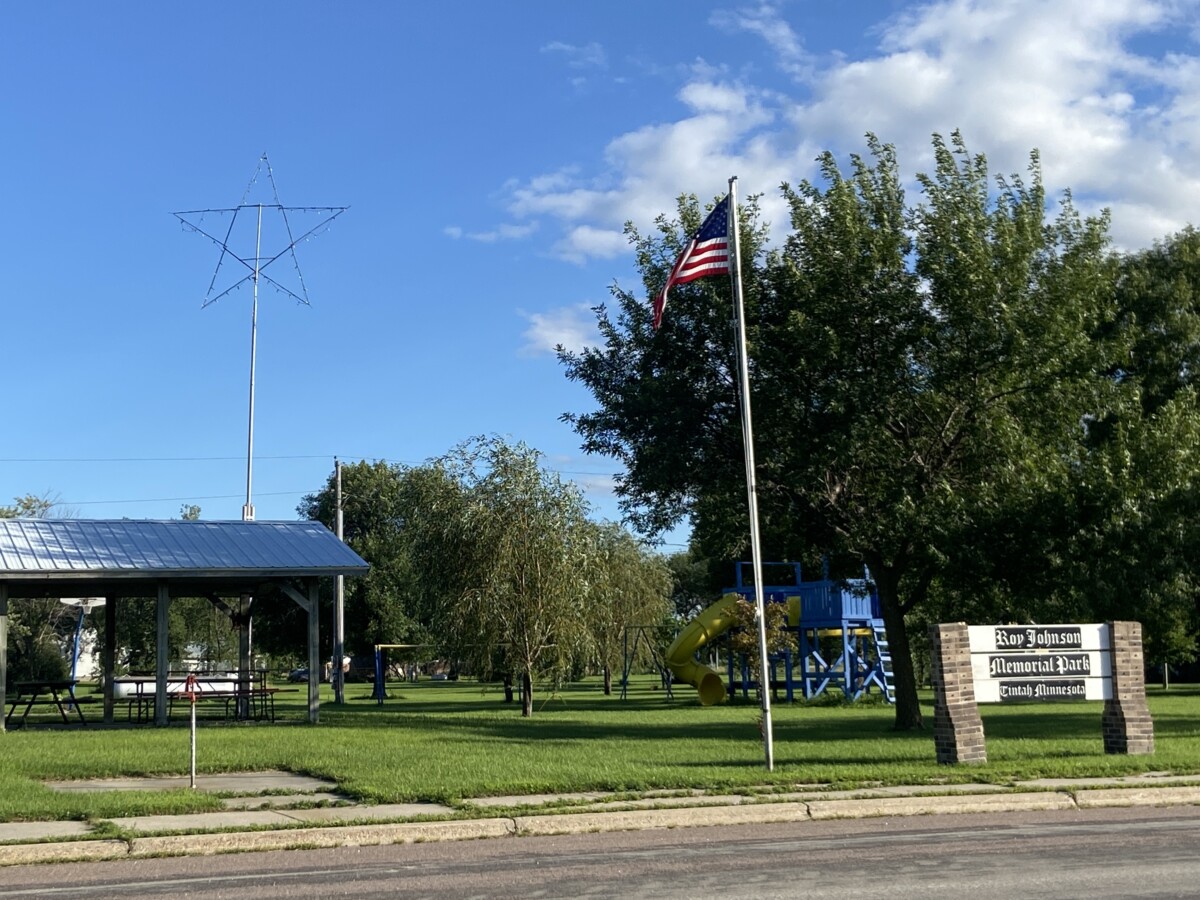 Shot of an American Flag in front of Roy Johnson Memorial Park in Tintah, Minnesota during the day. Shot of an American Flag in front of Roy Johnson Memorial Park in Tintah, Minnesota during the day.