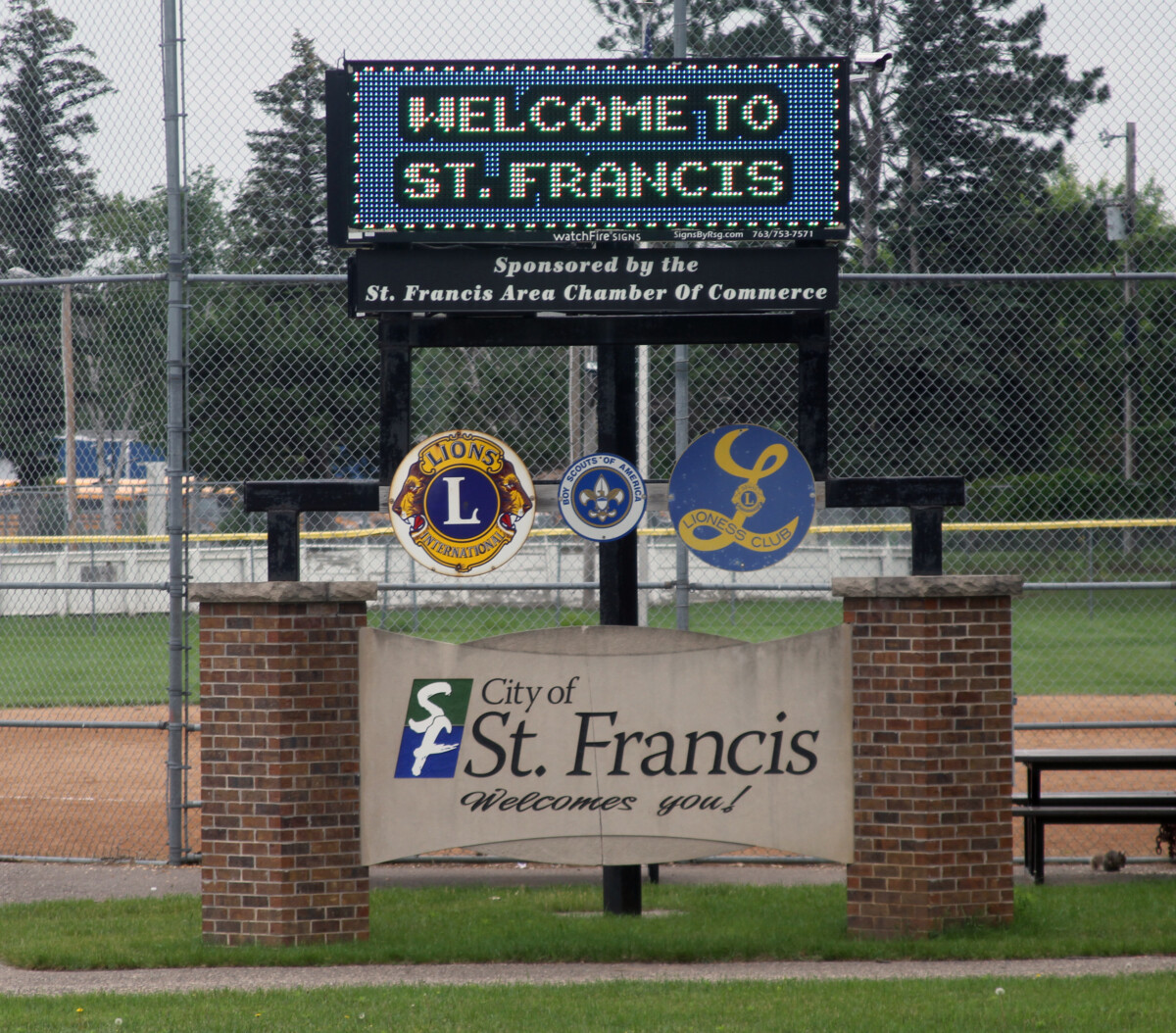 Welcome to St. Francis sign at baseball field with community logos in St. Francis, Minnesota, sponsored by local Chamber of Commerce Welcome to St. Francis sign at baseball field with community logos in St. Francis, Minnesota, sponsored by local Chamber of Commerce