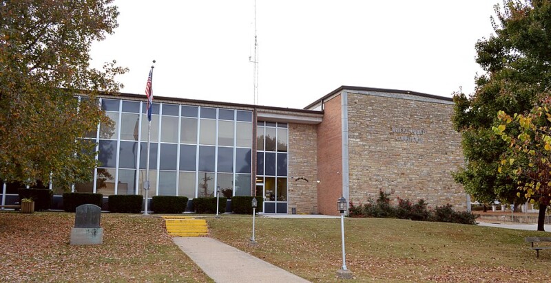 Wright County Courthouse in Hartville, Missouri, featuring a mid-century modern design with large glass windows and a stone façade Wright County Courthouse in Hartville, Missouri, featuring a mid-century modern design with large glass windows and a stone façade