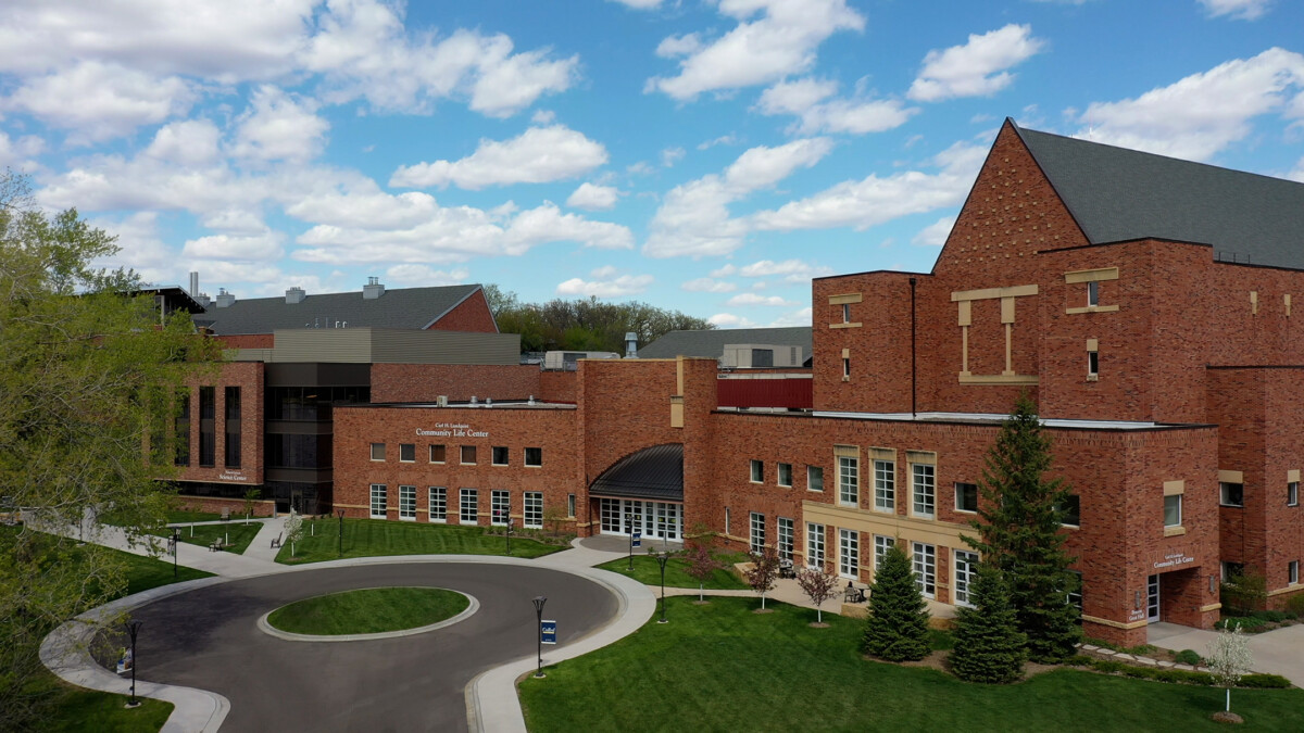 Bethel University Arden Hills Minnesota brick academic building with circular driveway and green lawn on wooded campus Bethel University Arden Hills Minnesota brick academic building with circular driveway and green lawn on wooded campus