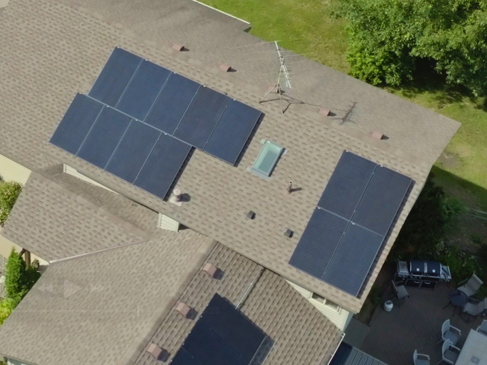 Aerial view of rooftop solar panel installation on a residential home by Wolf River Electric in Minnesota