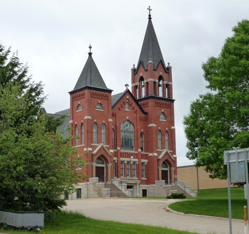 The front and side of the Swensson Farm Museum in Chippewa County, Minnesota during an overcast day.
