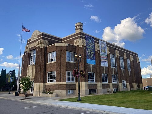 Snow-covered Minneapolis home with rooftop space suitable for solar panels, residential solar installation opportunity by Wolf River Electric