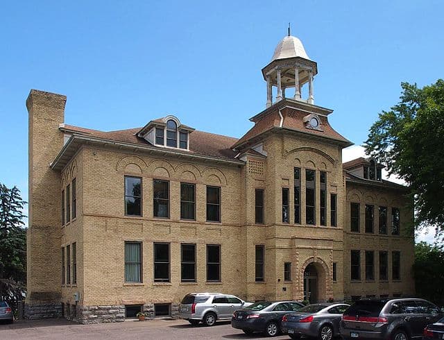 Snow-covered Minneapolis home with rooftop space suitable for solar panels, residential solar installation opportunity by Wolf River Electric