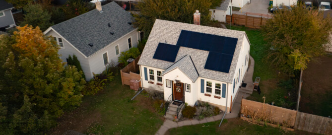 Aerial view of a Minneapolis home with rooftop solar panels installed by Wolf River Electric.