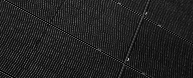 Close-up of black monocrystalline solar panels installed by Wolf River Electric