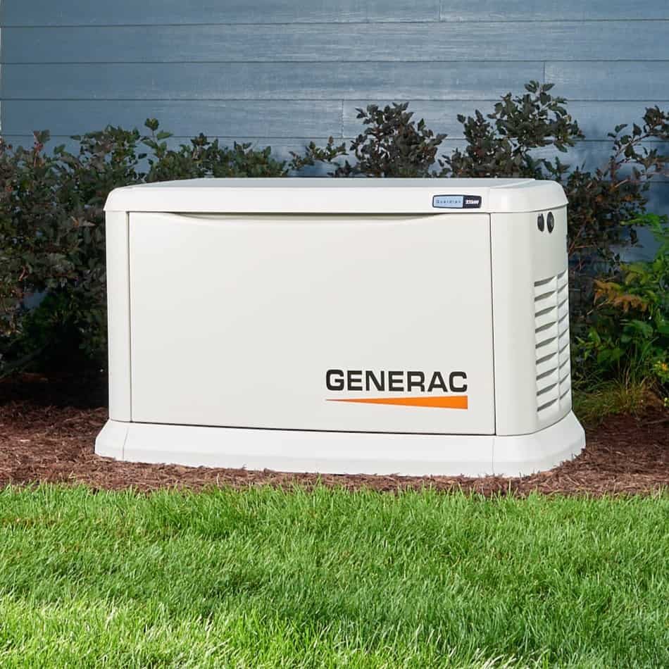 Generac Guardian standby generator beside blue siding