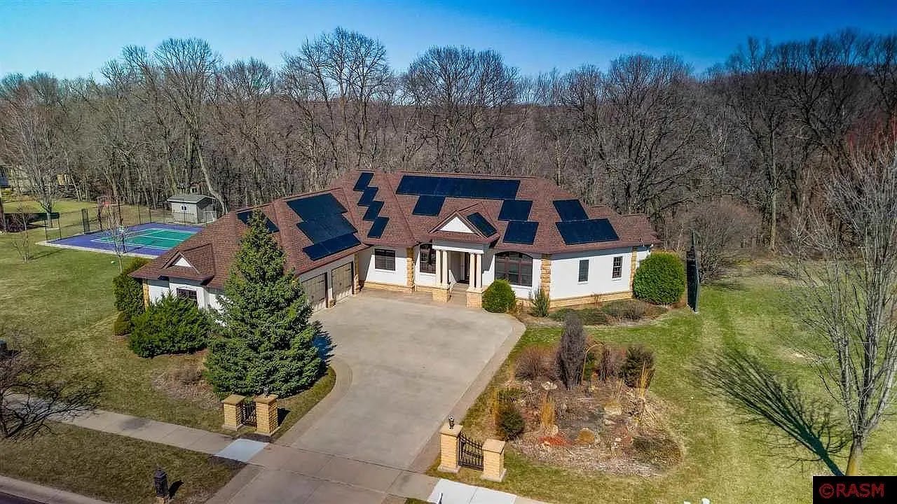 Aerial home curved drive with rooftop solar, installed by Wolf River Electric