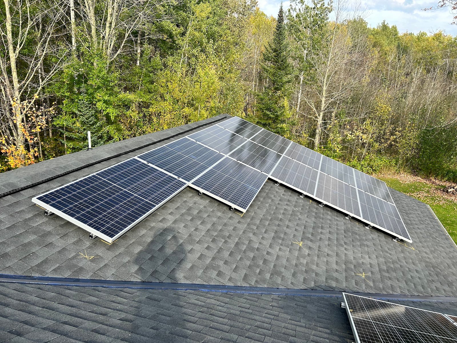 Aerial roof solar panels trees, installed by Wolf River Electric