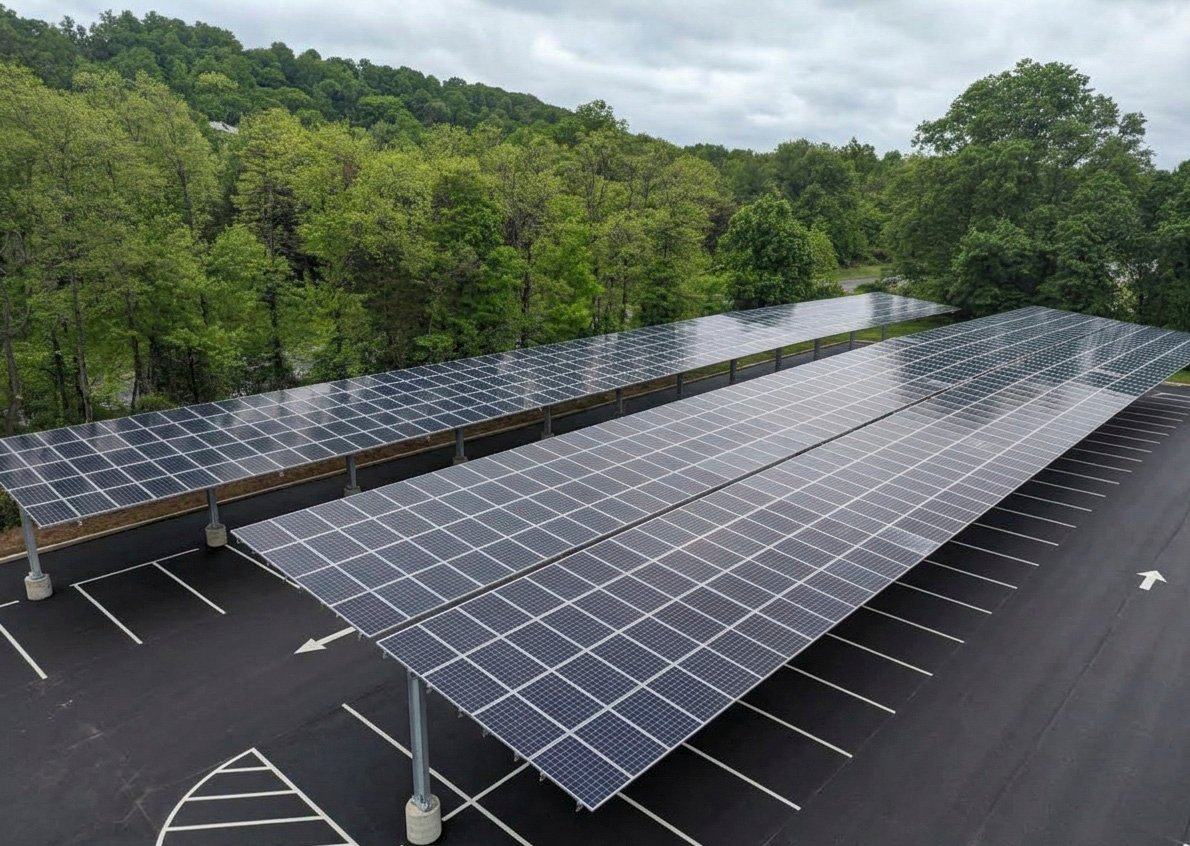Aerial view of a large commercial solar carport built by Wolf River Electric
