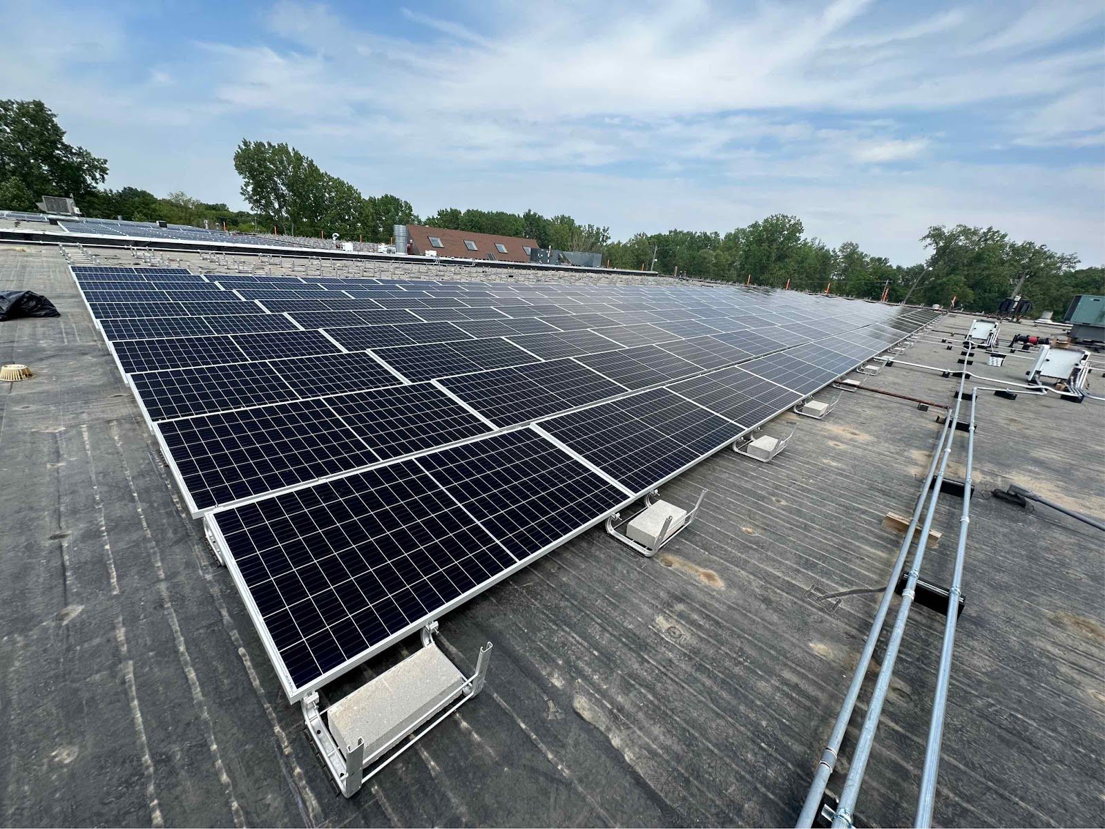 Commercial flat roof rows solar, installed by Wolf River Electric