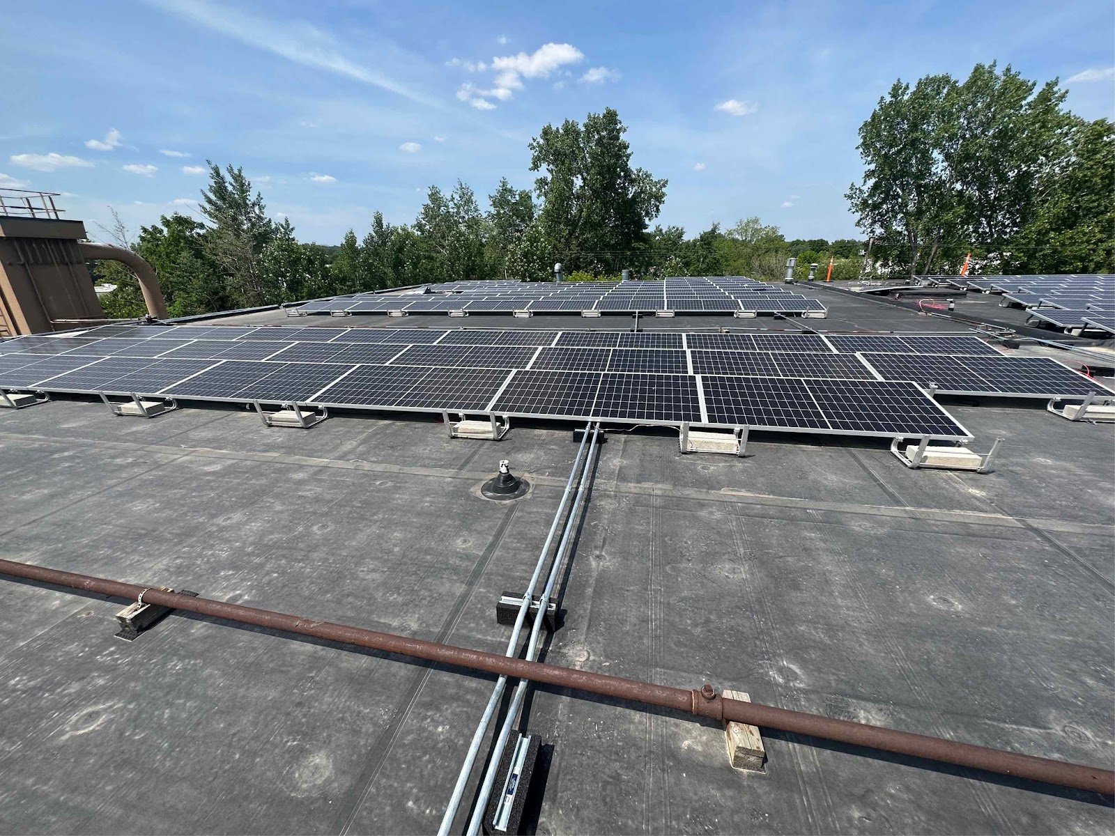 Commercial flat roof solar array trees, installed by Wolf River Electric