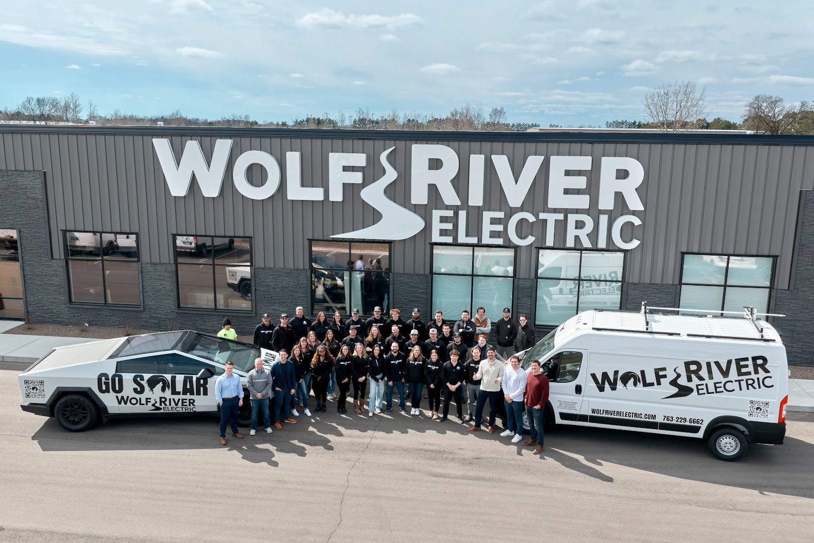 The Wolf River Electric team outside our Isanti headquarters