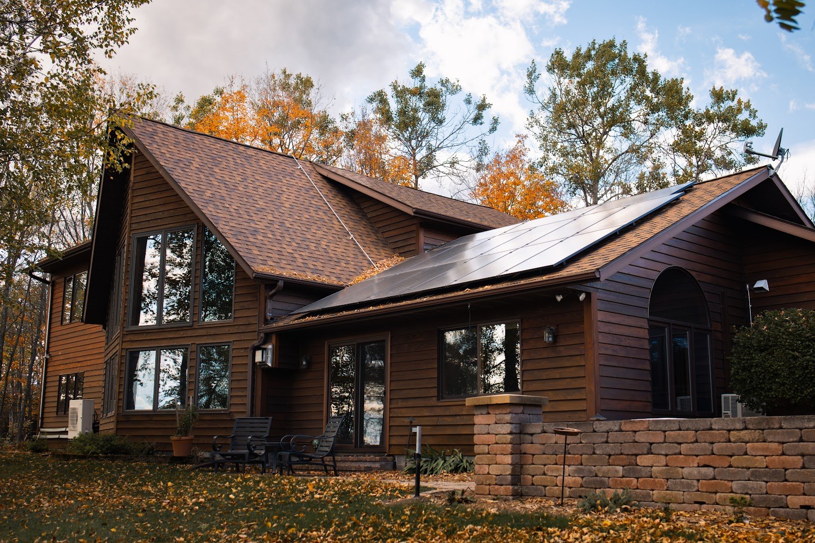 Fall home with solar panels, installed by Wolf River Electric
