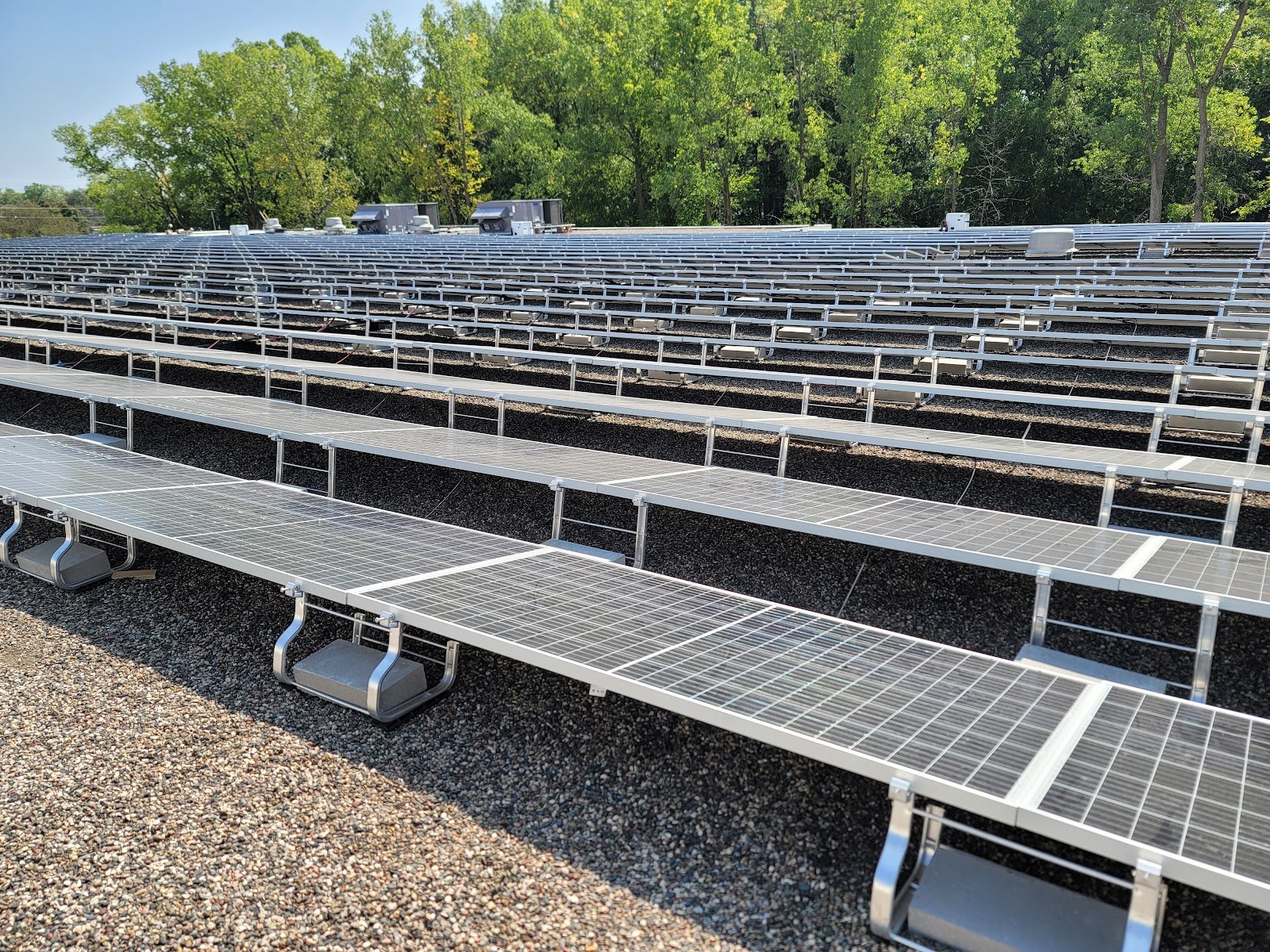 Flat roof panel rows solar, installed by Wolf River Electric