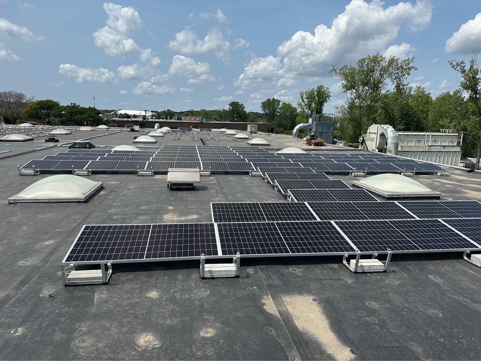 Flat roof solar array, installed by Wolf River Electric