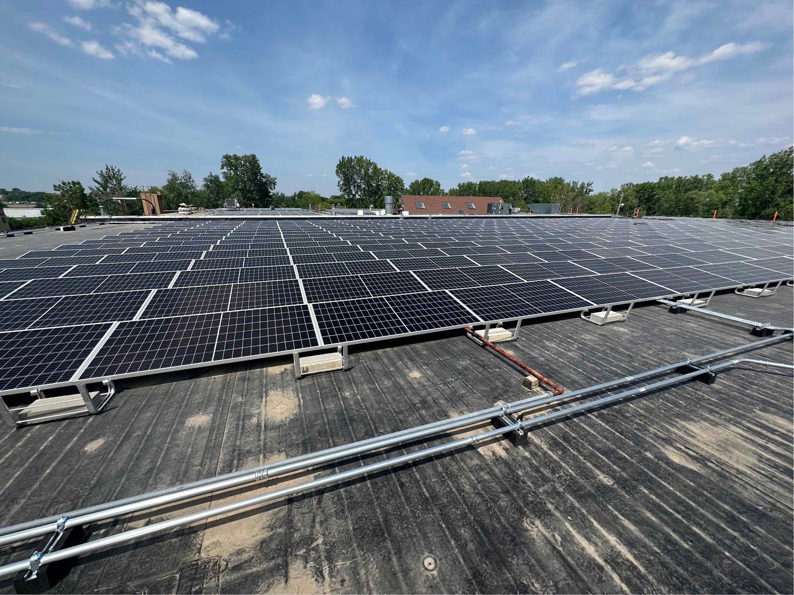 Large commercial rooftop solar array that can be paired with battery storage, installed by Wolf River Electric