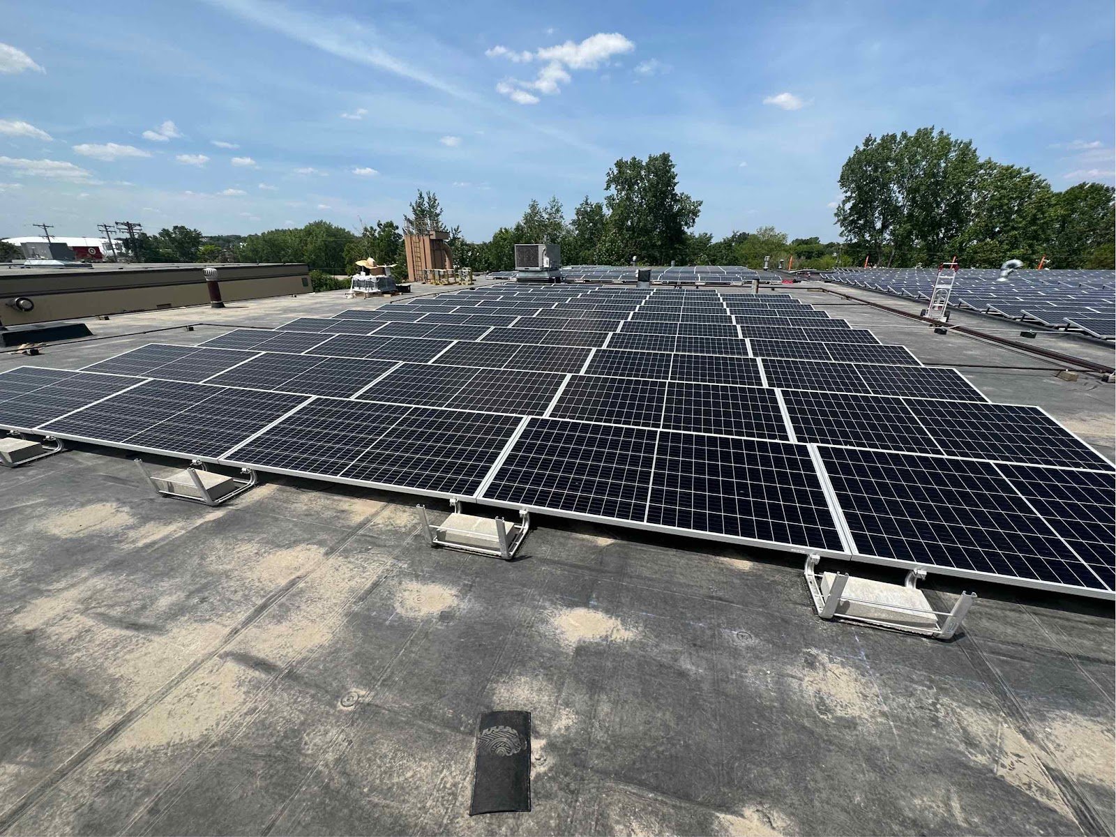 Flat roof solar array wide, installed by Wolf River Electric
