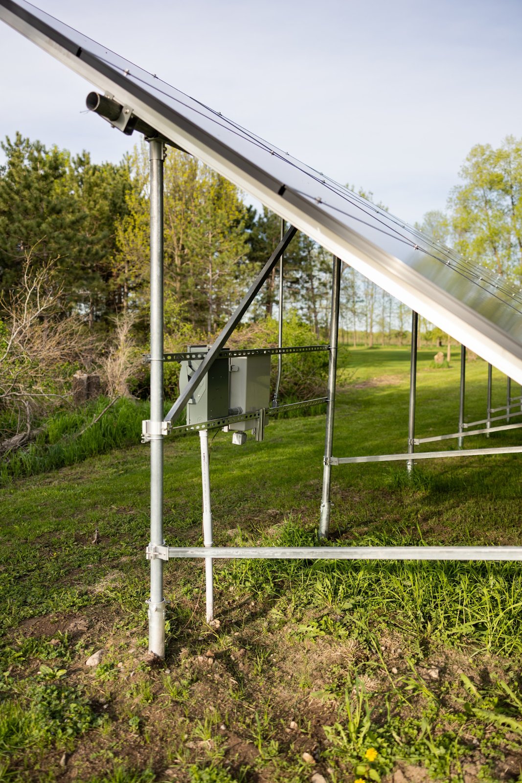 Ground-mount solar array racking underside, installed by Wolf River Electric