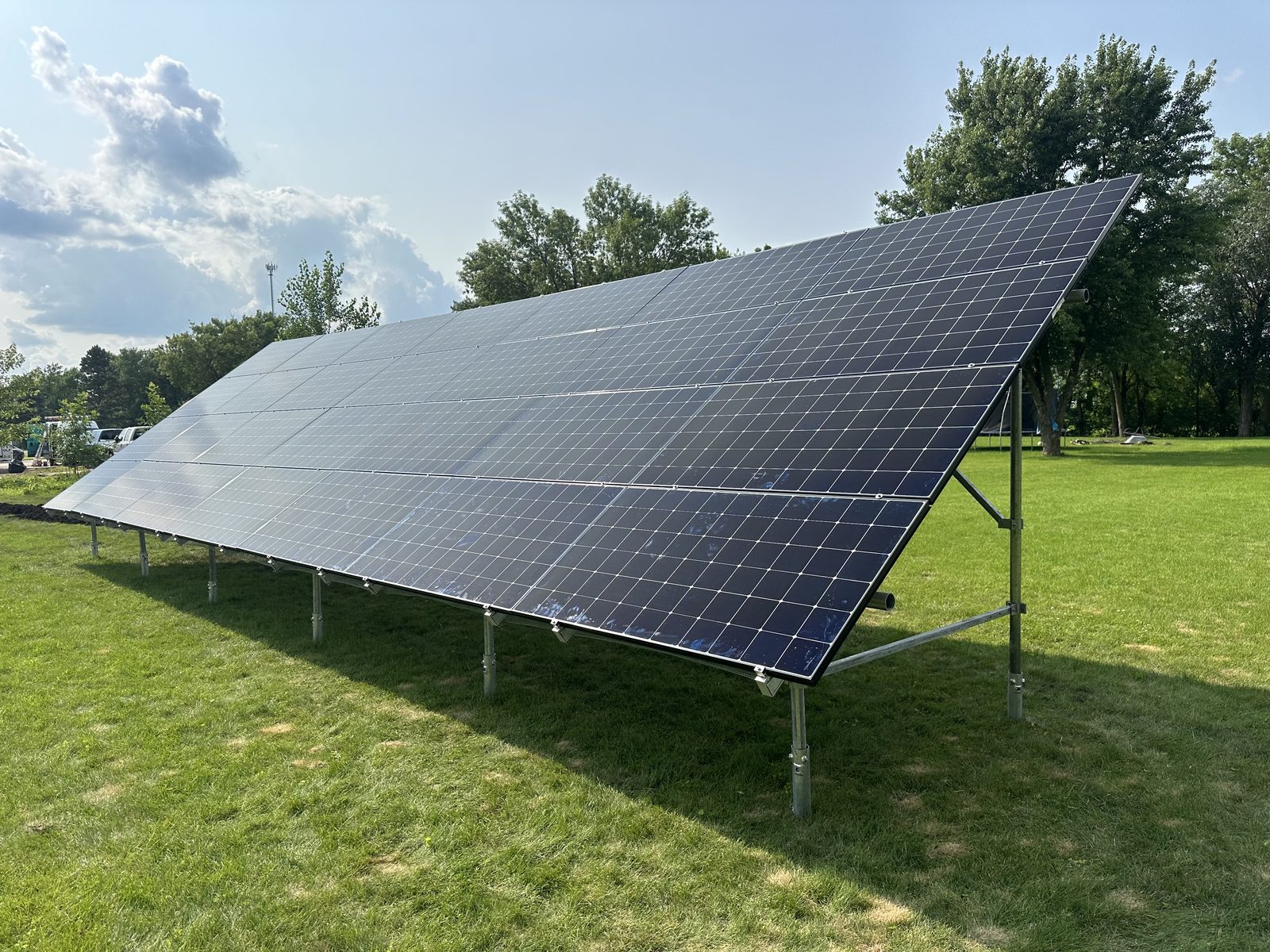 Ground-mount solar, end view, installed by Wolf River Electric