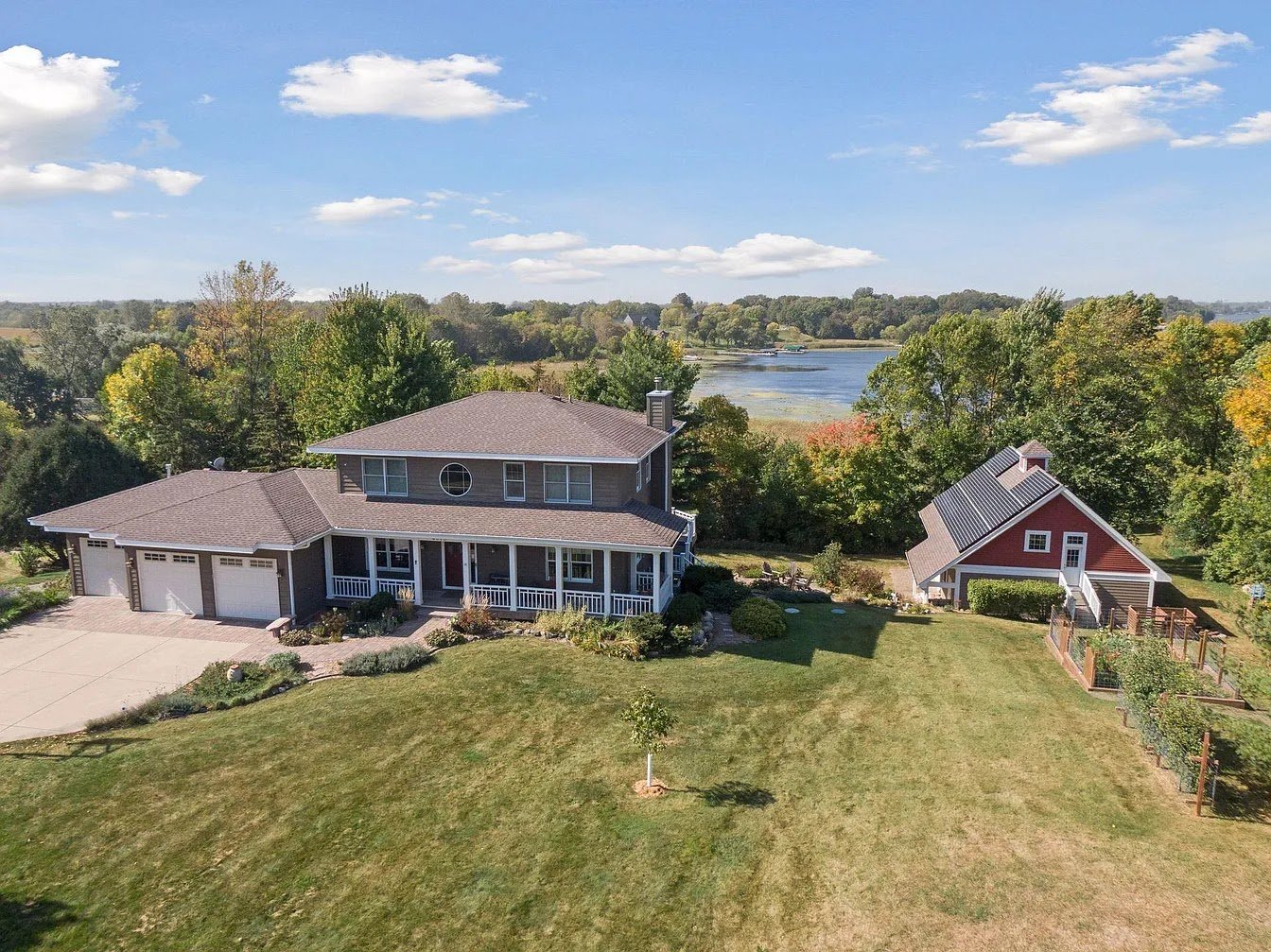 Home aerial hillside with rooftop solar, installed by Wolf River Electric