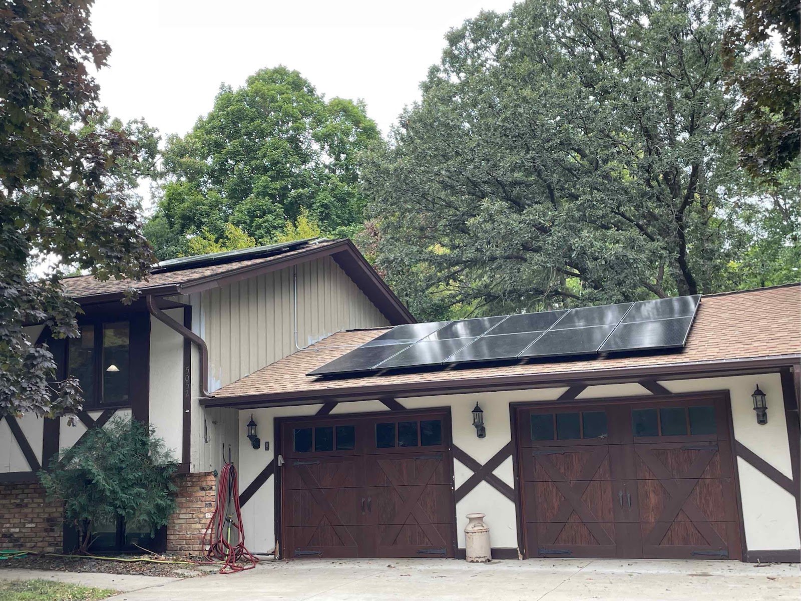 Garage with solar panels blue sky, installed by Wolf River Electric