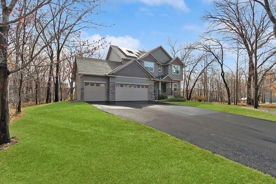 Home in woods solar panels, installed by Wolf River Electric