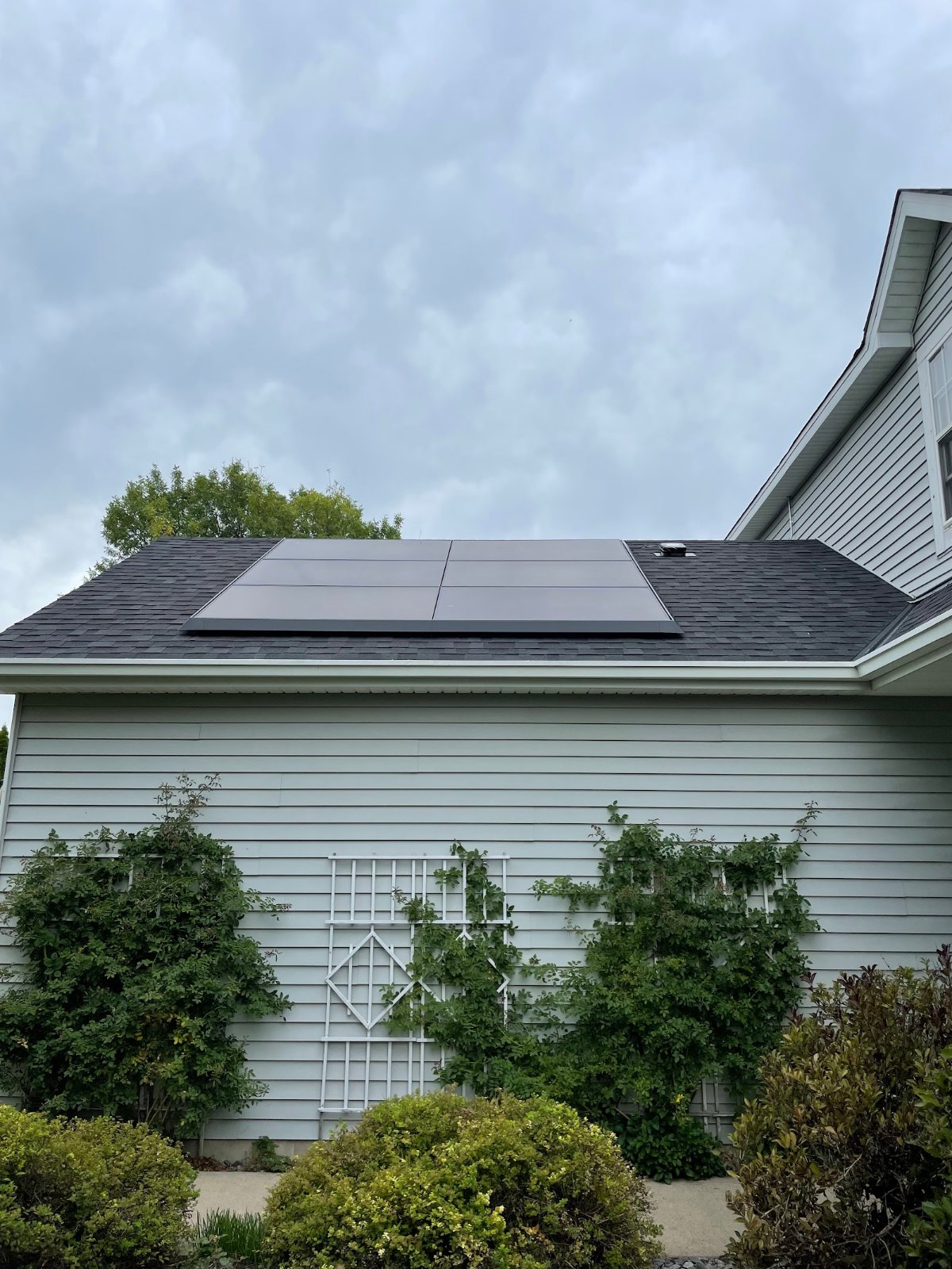 Home with solar panels, installed by Wolf River Electric