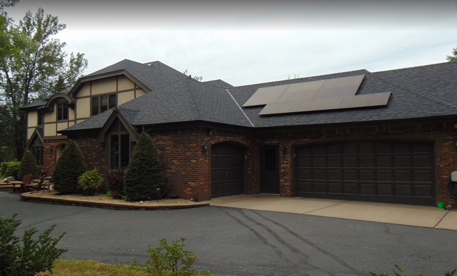 Home with solar panels driveway, installed by Wolf River Electric