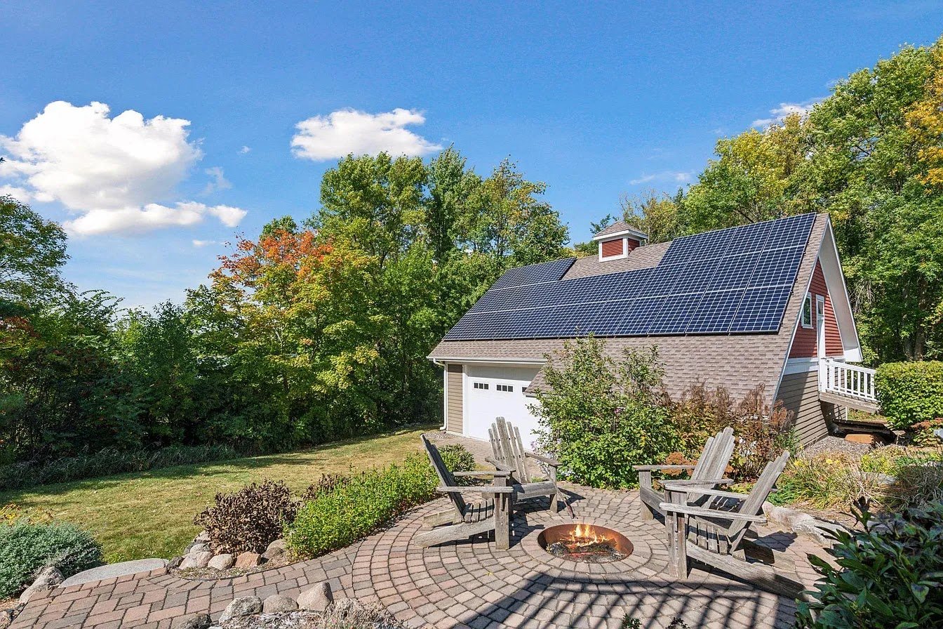 Home with solar panels fall color, installed by Wolf River Electric